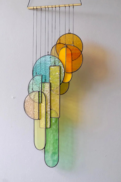 Autumn 2 stained glass hanging sculpture with colorful circular and rectangular yellow green blue and orange pieces