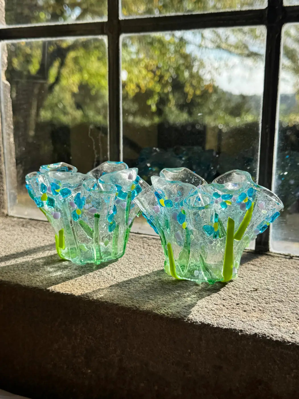 Two translucent glass forget-me-not tea-light holders with ruffled blue and green floral flecks set of 2