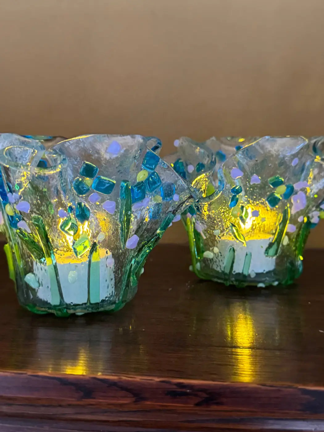 Two handcrafted glass tealight holders with a mosaic design in blue green and purple accents set of 2