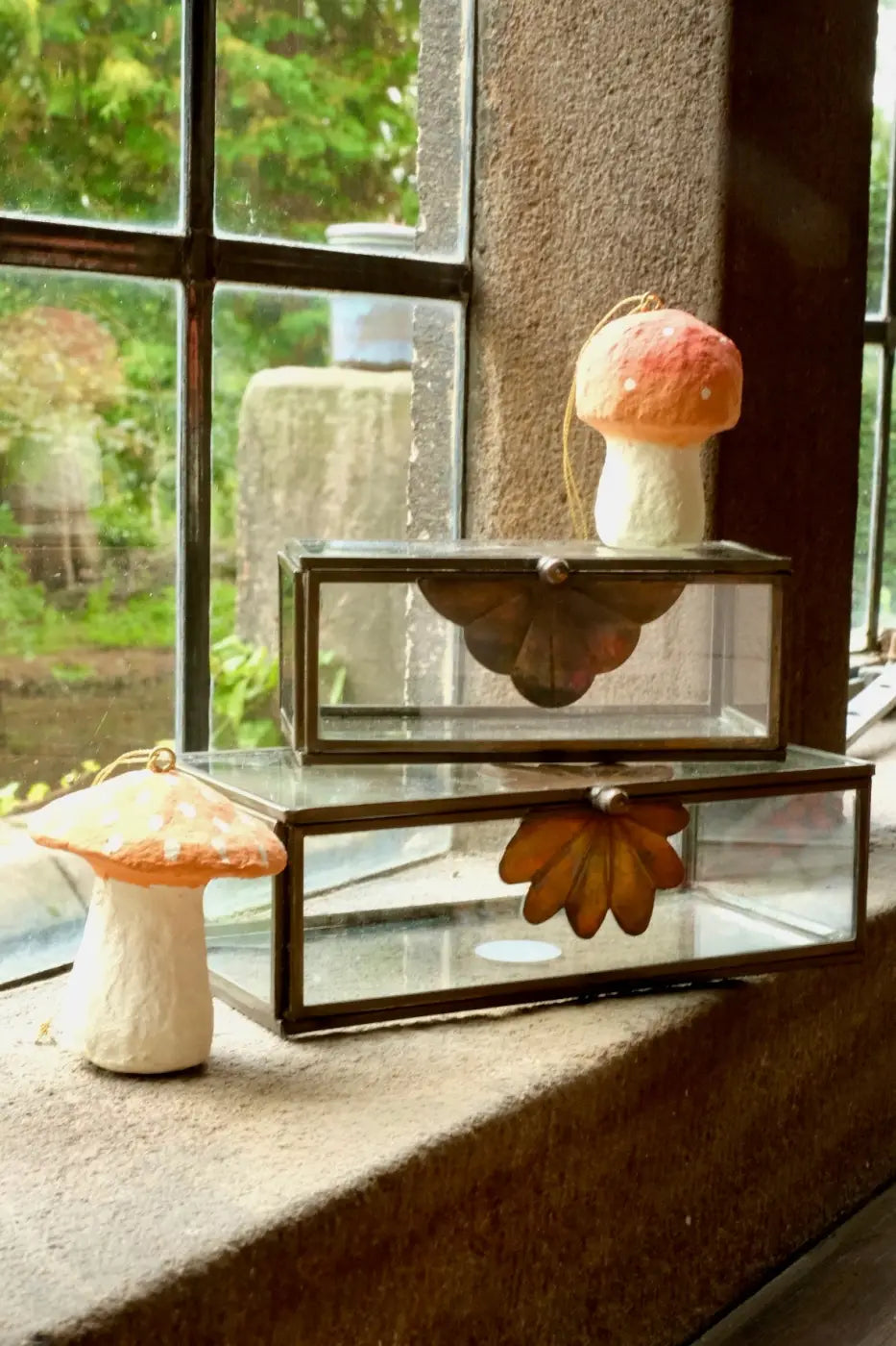 A soft orange and white felt mushroom ornament with gold hanging string featured with glass trinket boxes set of 2