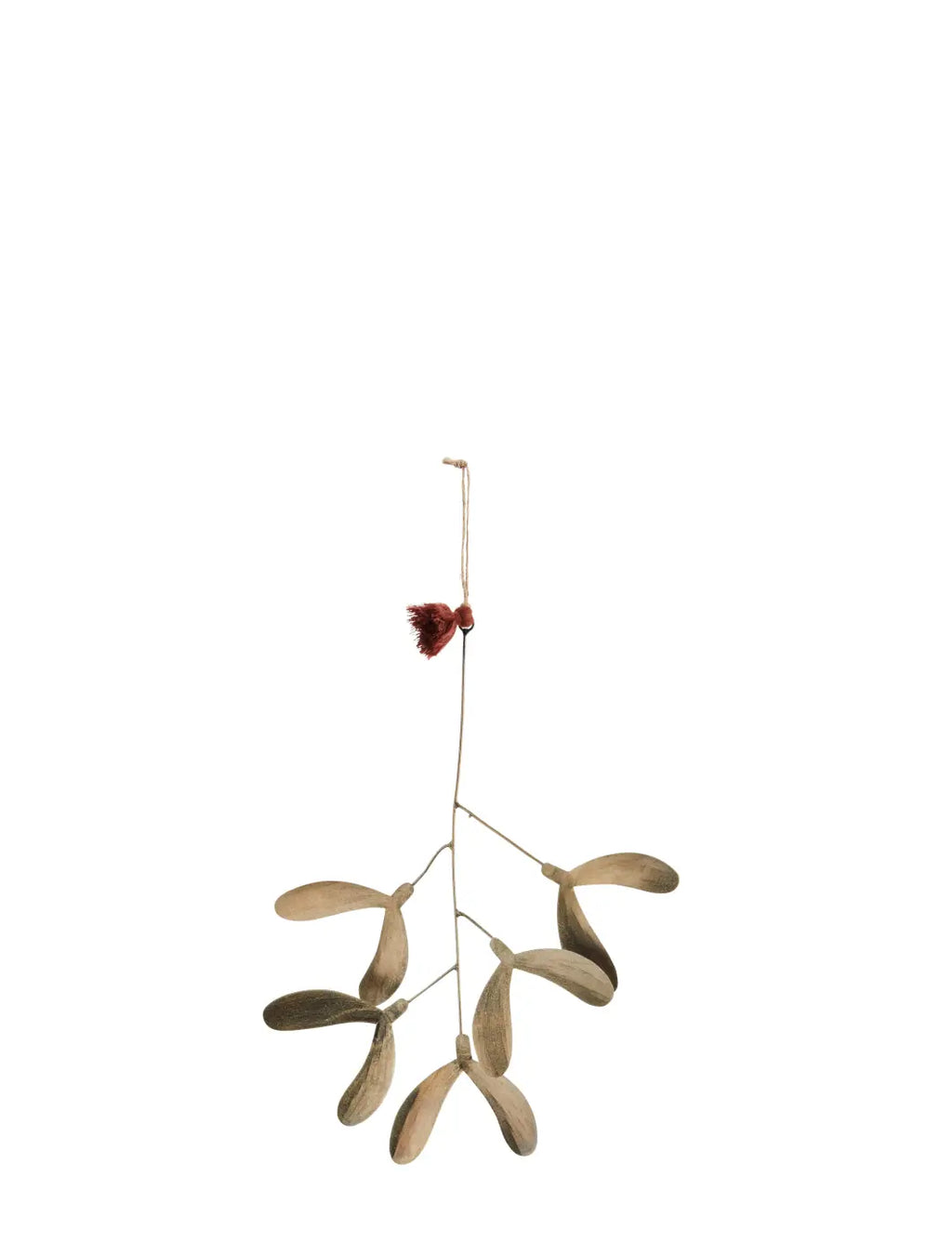 A delicate light brown handmade iron mistletoe ornament with a small red tassel at the top