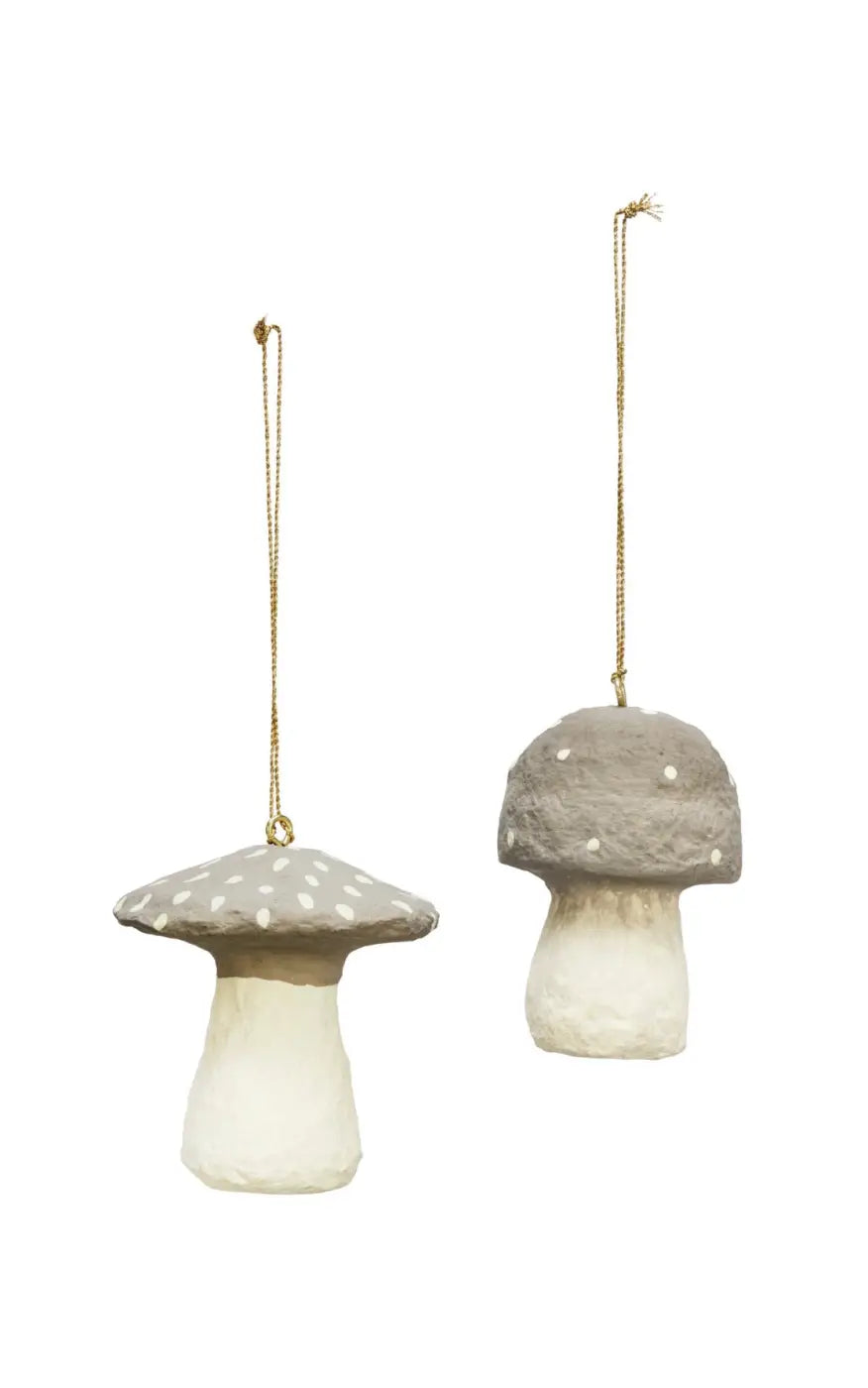 Handmade toadstool decorations featuring gray mushroom-shaped ornaments with white polka dots and a textured matte finish