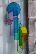 Lawrence 1 stained glass sun catcher wind chime with vibrant geometric shapes in blue purple green and yellow