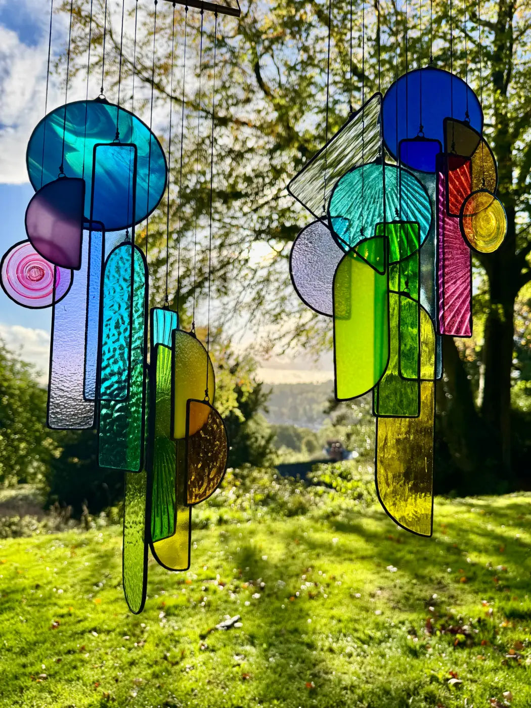 Lawrence 2 stained glass sun catcher artwork with vibrant multicolored geometric shapes and textured surfaces wind chime
