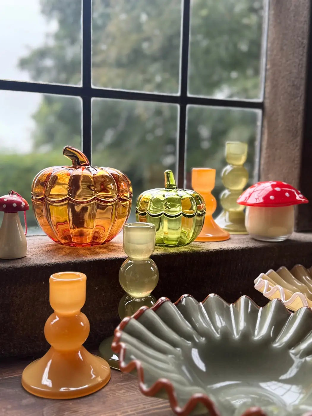 Amber-colored ribbed glass pumpkin-shaped container with small stem in pumpkin glass bowls set of 2