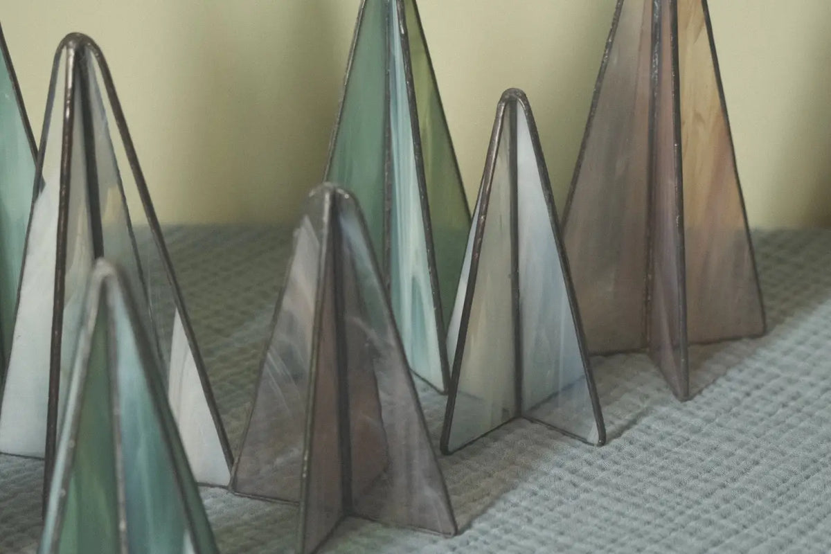 Sapin trees set of three stained glass triangular tree ornaments in green blue and brown with dark metal framing