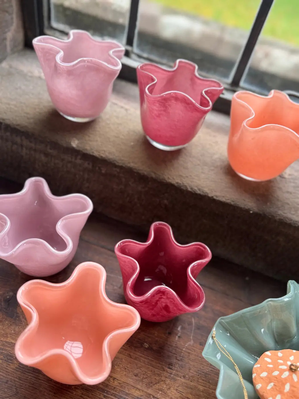 Small ruffle vase ceramic flower-shaped bowls in pastel and vibrant pink red and orange with a glossy finish